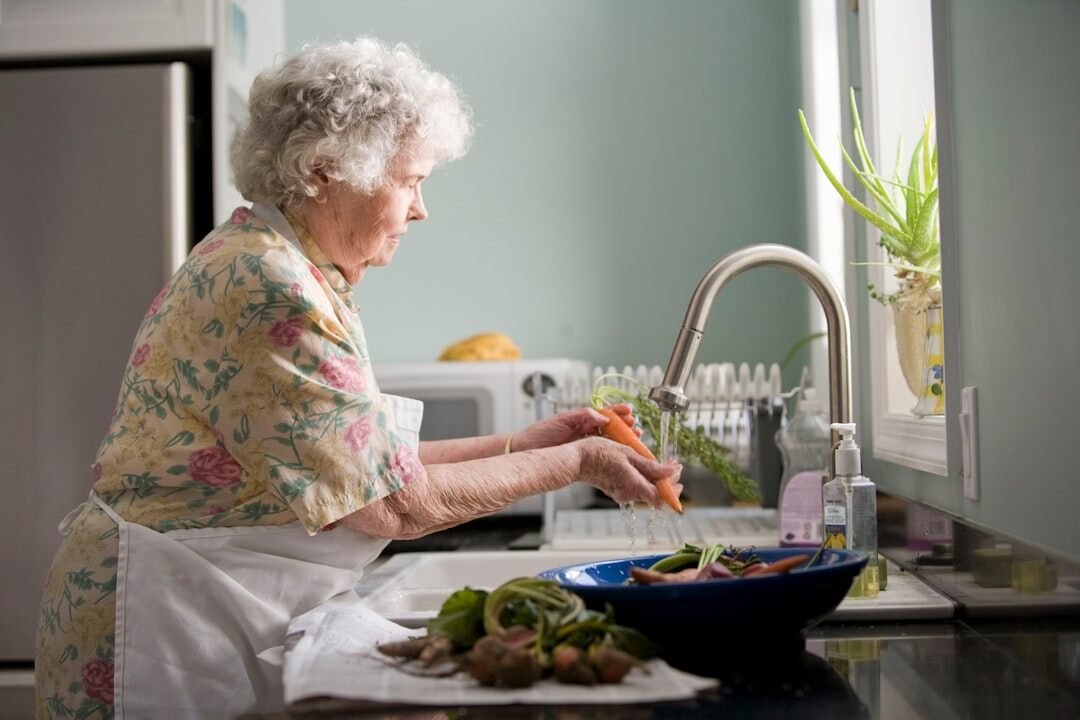 elderly person drinking water