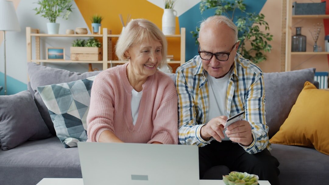 senior citizen using laptop at home