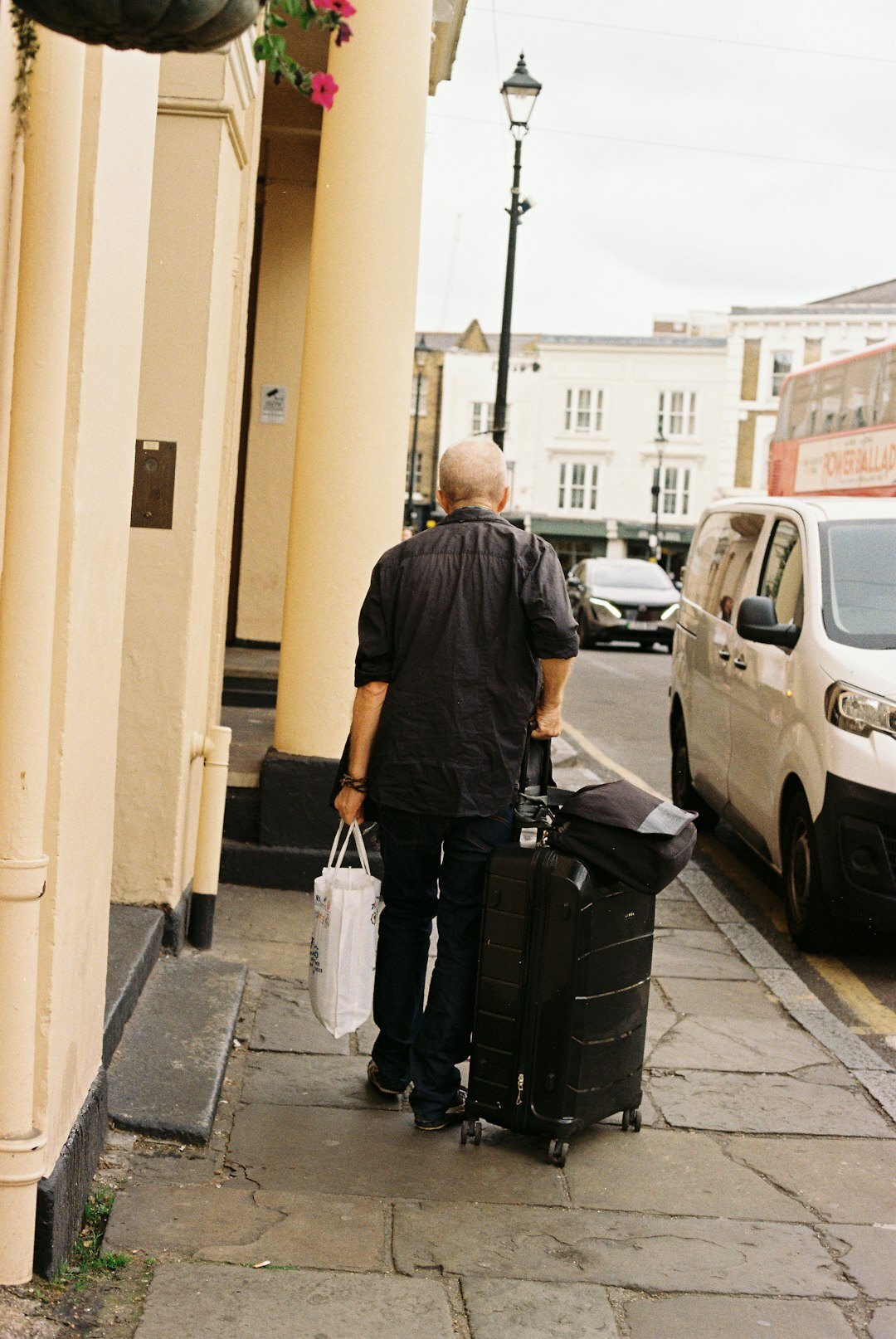 elderly couple packing luggage
