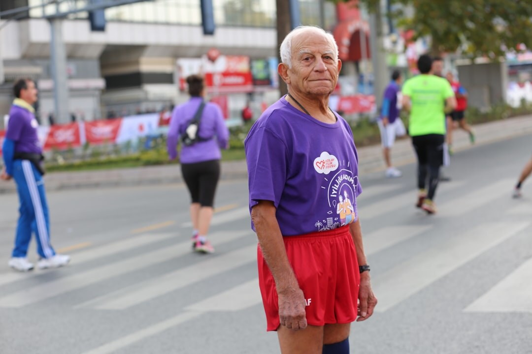 senior man running marathon